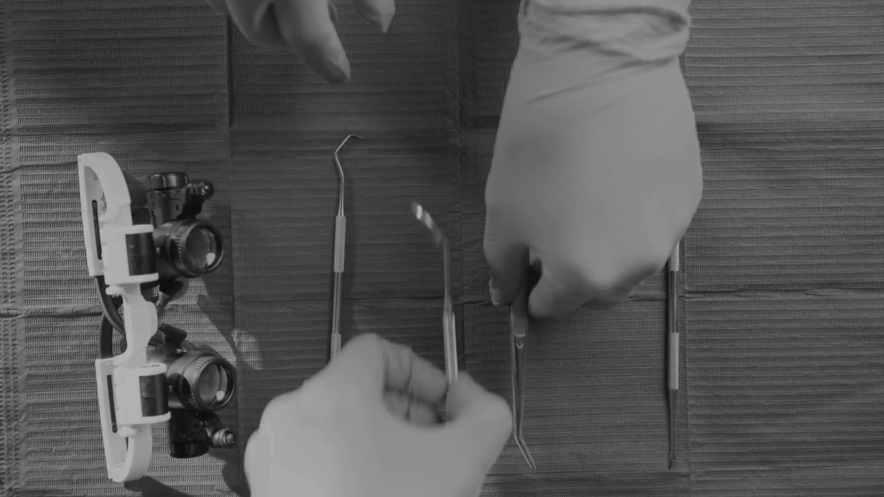 Dental instruments laid out on a tray in a treatment room